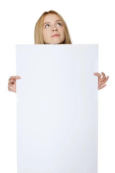 Girl holding peeking out the adge of blank banner — Stock Photo, Image