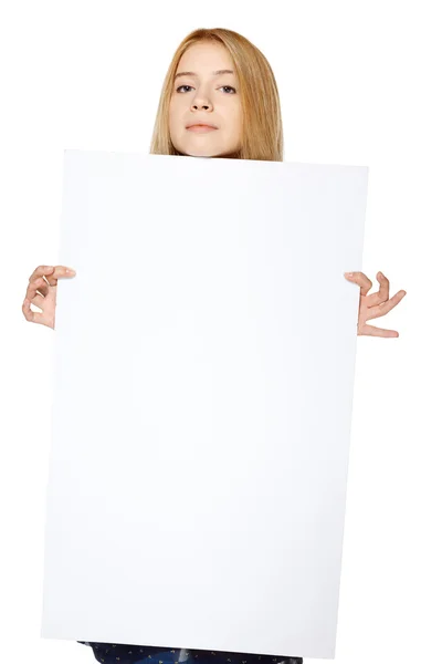 Girl holding peeking out the adge of blank banner — Stock Photo, Image