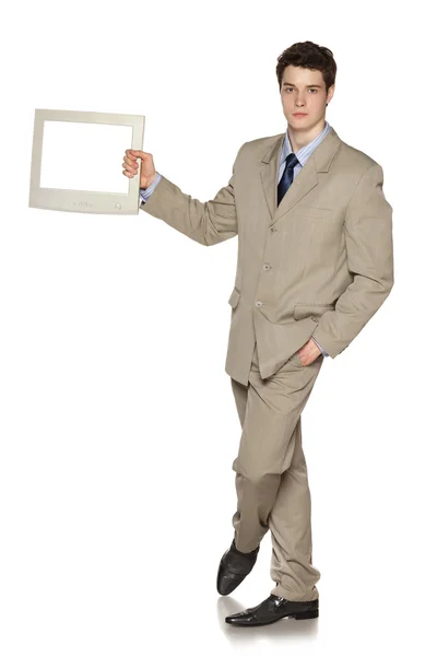 Young businessman holding TV — Stock Photo, Image