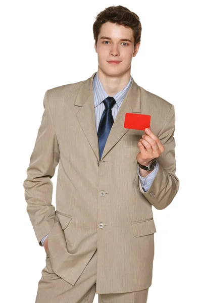 Hombre de negocios con tarjeta de crédito en blanco — Foto de Stock