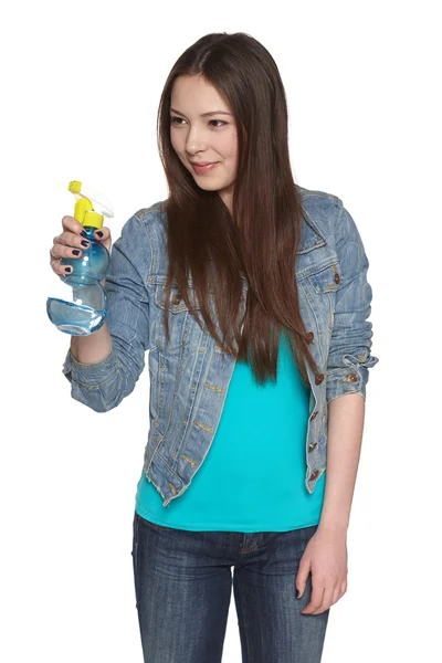 Smiling young woman with cleaning spray bottle — Stock Photo, Image