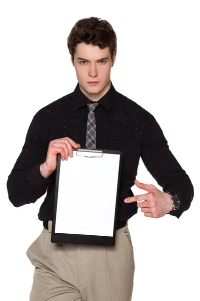 Severe businessman holding blank clipboard — Stock Photo, Image