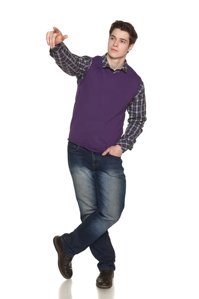 Full length man pointing at blank copy space — Stock Photo, Image