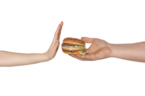 Tangan wanita menolak makanan cepat saji Stok Gambar