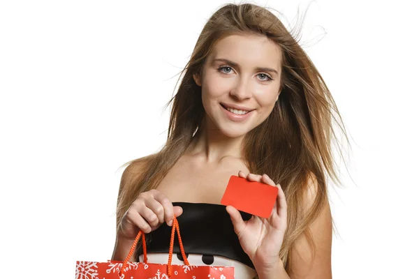 Woman holding bag and blank credit card — Stock Photo, Image