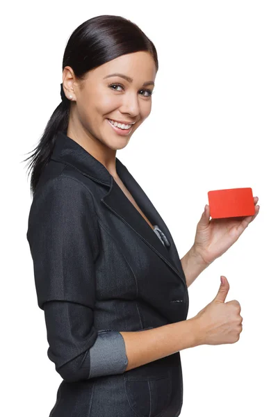 Business woman showing credit card and gesturing thumb up — Stock Photo, Image