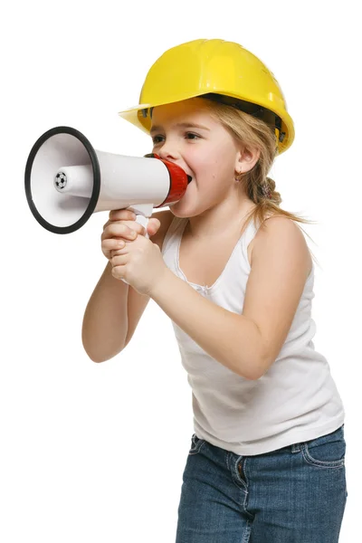 Little girl builder in yellow helmet screaming into the loudspeaker — Stock Photo, Image