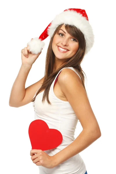 Dziewczyna w santa hat trzyma kształt serca — Zdjęcie stockowe