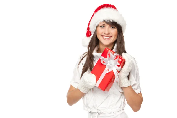 Girl in Santa hat holding red gift box — Stock Photo, Image