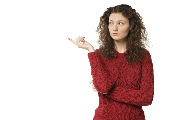 Female in sweater pointing at copy space — Stock Photo, Image