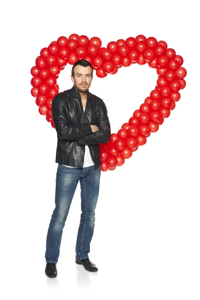 Man standing in front of heart shape — Stock Photo, Image