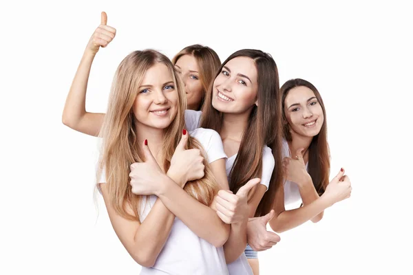 Happy group of friends gesturing thumbs up — Stok Foto