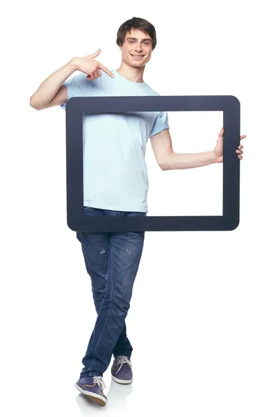 Comprimento total homem segurando quadro tablet — Fotografia de Stock