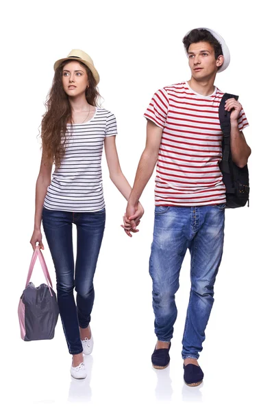 Giovane coppia camminando con borse da viaggio — Stock Fotó
