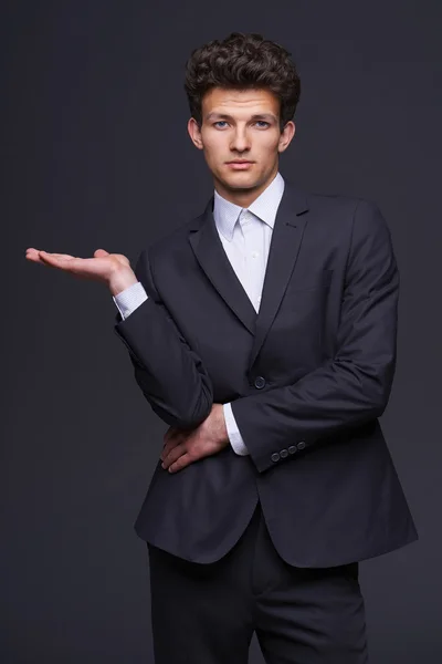 Businessman showing something — Stock Photo, Image