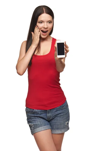 Excited surprised woman showing cell phone — Stock Photo, Image