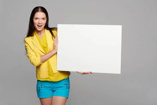 Happy Excited Girl Yellow Blue Holding Empty Whiteboard — Stock Fotó