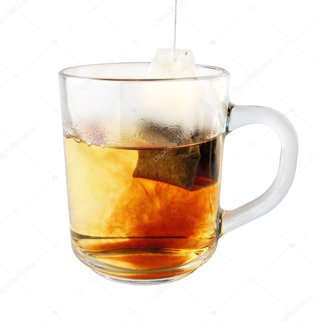 hot tea in glass mug with packet