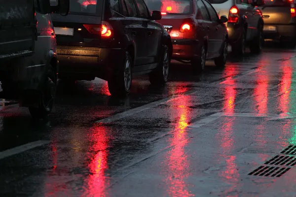 Cars in traffic jam on wet road — Stock Photo, Image