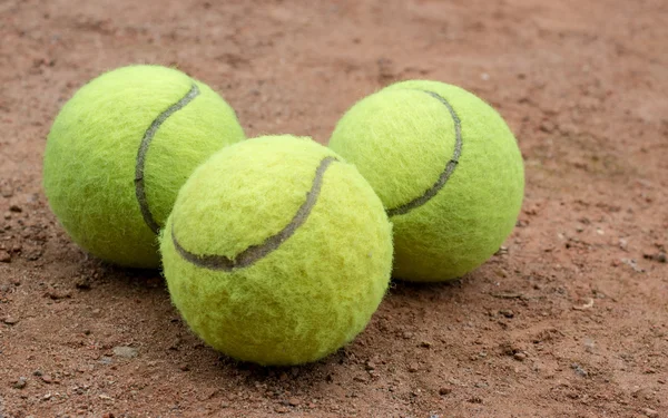Three tennis balls