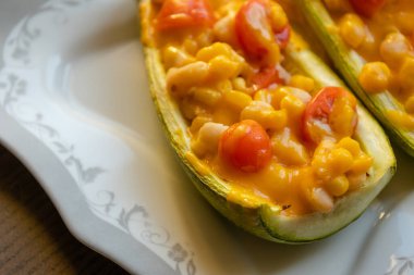mediterranean food stuff zucchini with corn beans and cherry tomatoes with cheder cheese 