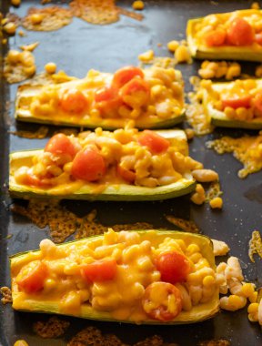 mediterranean food stuff zucchini with corn beans and cherry tomatoes with cheder cheese 