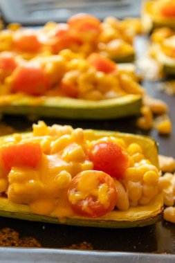 mediterranean food stuff zucchini with corn beans and cherry tomatoes with cheder cheese 