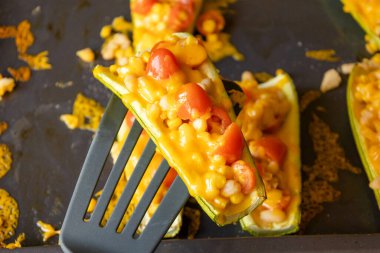 mediterranean food stuff zucchini with corn beans and cherry tomatoes with cheder cheese 