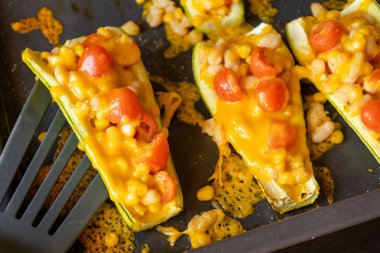 mediterranean food stuff zucchini with corn beans and cherry tomatoes with cheder cheese 