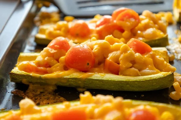 mediterranean food stuff zucchini with corn beans and cherry tomatoes with cheder cheese 