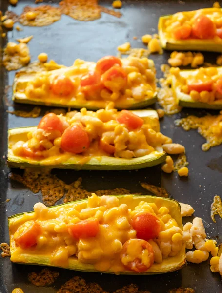mediterranean food stuff zucchini with corn beans and cherry tomatoes with cheder cheese 