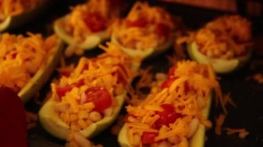 cooking preparing  mediterranean    courgette  with beans corn and cherry tomatoes