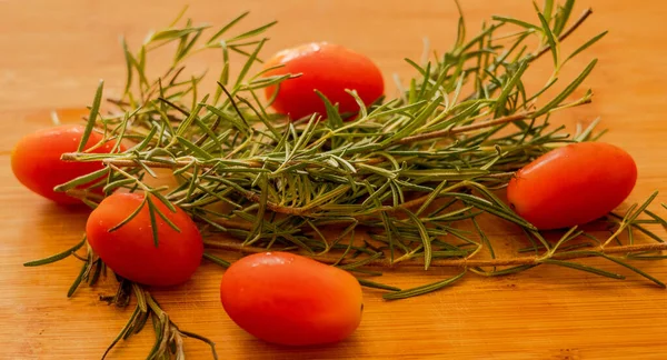 Cherry Tomatoes Rosemary Close Wooden Table — Zdjęcie stockowe