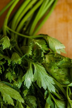 celery leaf close up on wooden board