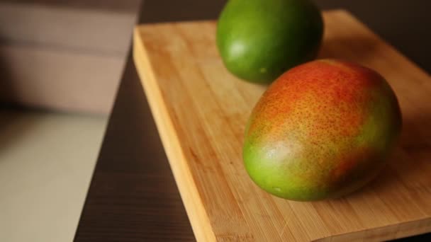 Two Mangos Close Wooden Board — Stock video