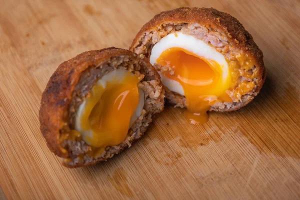 Homemade English Scotch Eggs Wrapped in Sausage close up