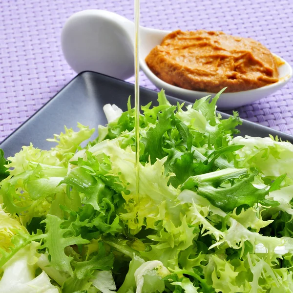 Escarole endive with romesco sauce, a typical salad from Catalon — Stock Photo, Image