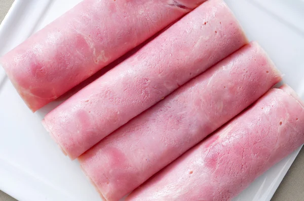 Plate with some rolled slices — Stock Photo, Image