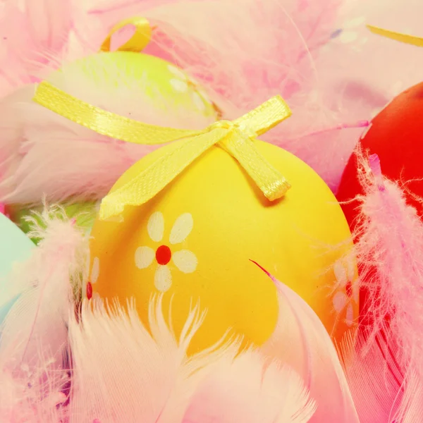 Easter eggs and feathers — Stock Photo, Image