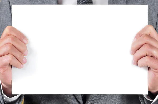 Man in suit holding a blank signboard — Stock Photo, Image