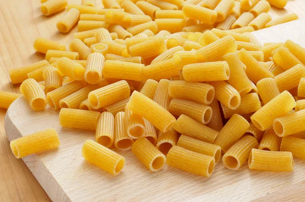 Uncooked penne pasta — Stock Photo, Image