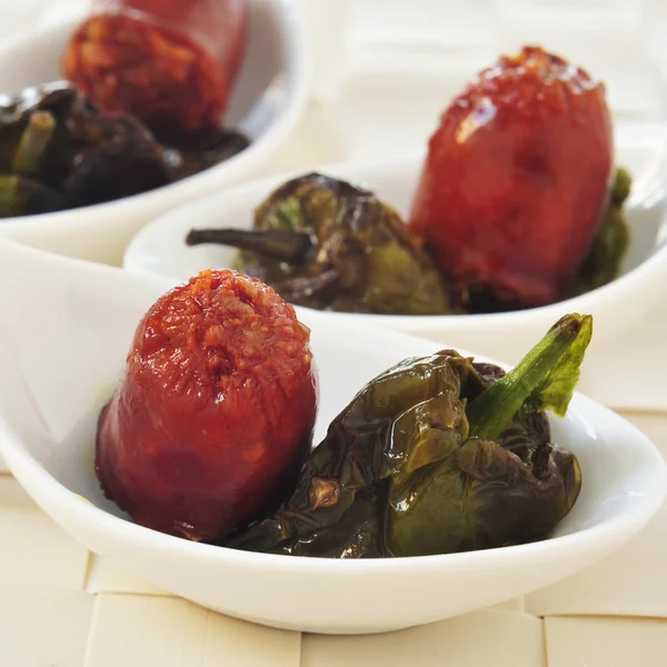 Spanish fried chorizo and Padron peppers served as tapas — Stock Photo, Image