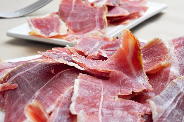 Spanish serrano ham served as tapas — Stock Photo, Image