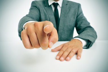 man in suit pointing the finger clipart