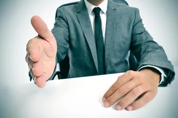 Man in suit offering to shake hands — Stock Photo, Image