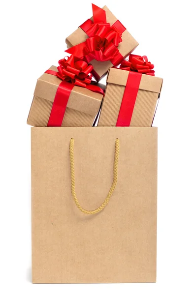 Gifts in a shopping bag — Stock Photo, Image