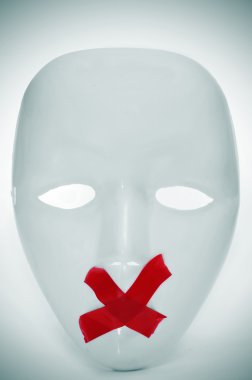 mask with its mouth shut with red tape clipart
