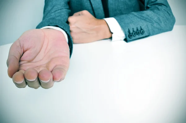 Man in suit with an outstretched hand — Stock Photo, Image