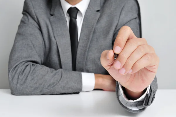 Man in suit with a pen — Stock Photo, Image