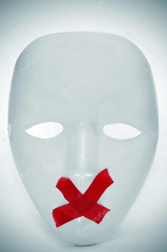 mask with its mouth shut with red tape